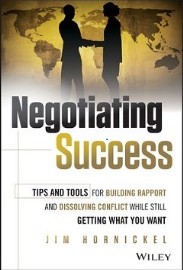Negotiating Success book cover; handshake, world map