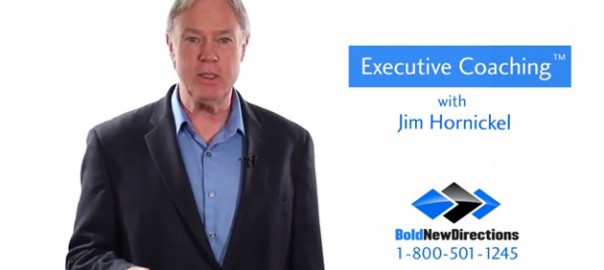 Man in suit beside executive coaching ad