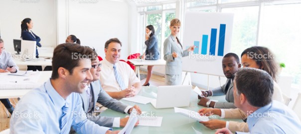 Business team meeting with presenter and growth chart
