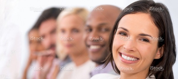 Smiling woman with diverse office colleagues