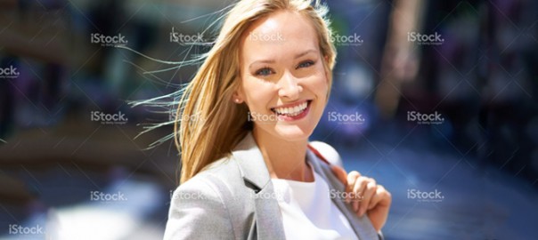 Smiling blonde woman in business attire