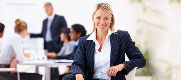 Smiling businesswoman at office team meeting