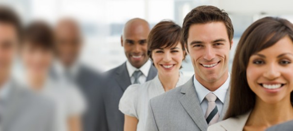 Smiling business professionals standing in a line