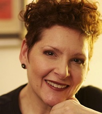 Smiling woman resting chin on hand