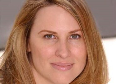 Smiling blonde woman close-up portrait